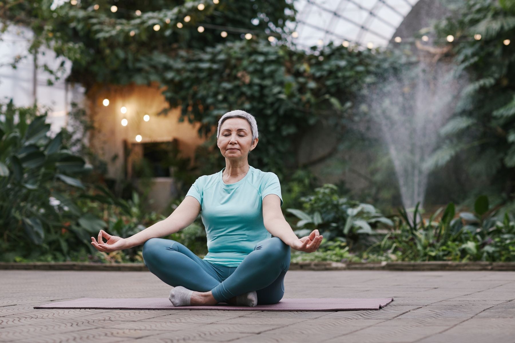 An older woman enjoying a mindful outdoor exercise practice