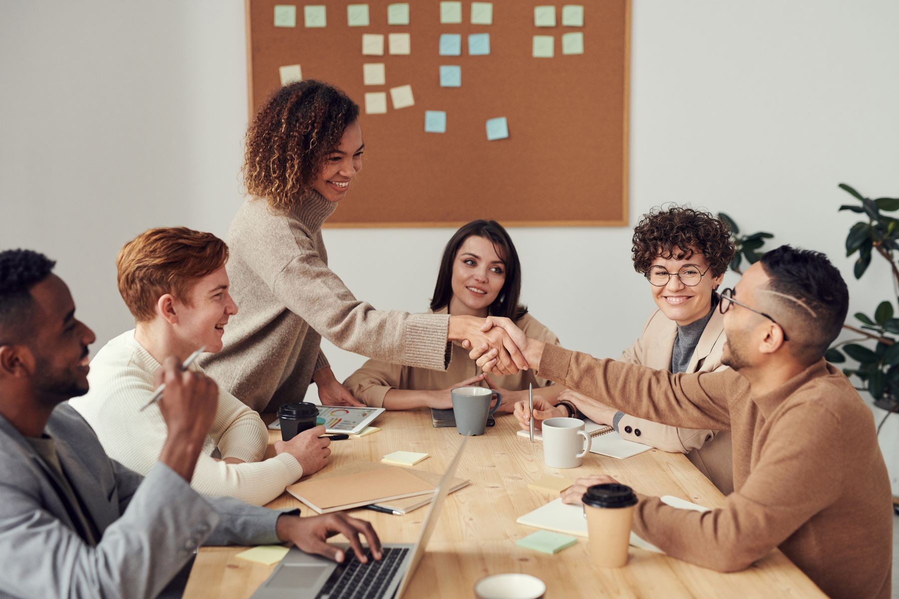 Colleagues gathered for a collaborative group discussion