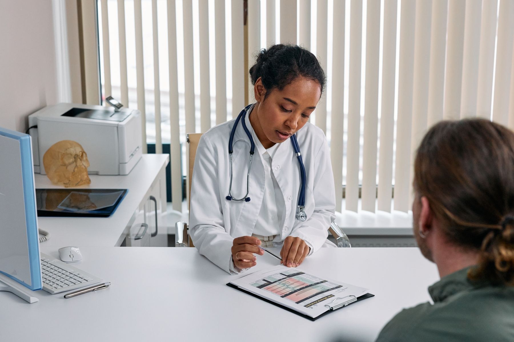 A clinician explaining information to a patient