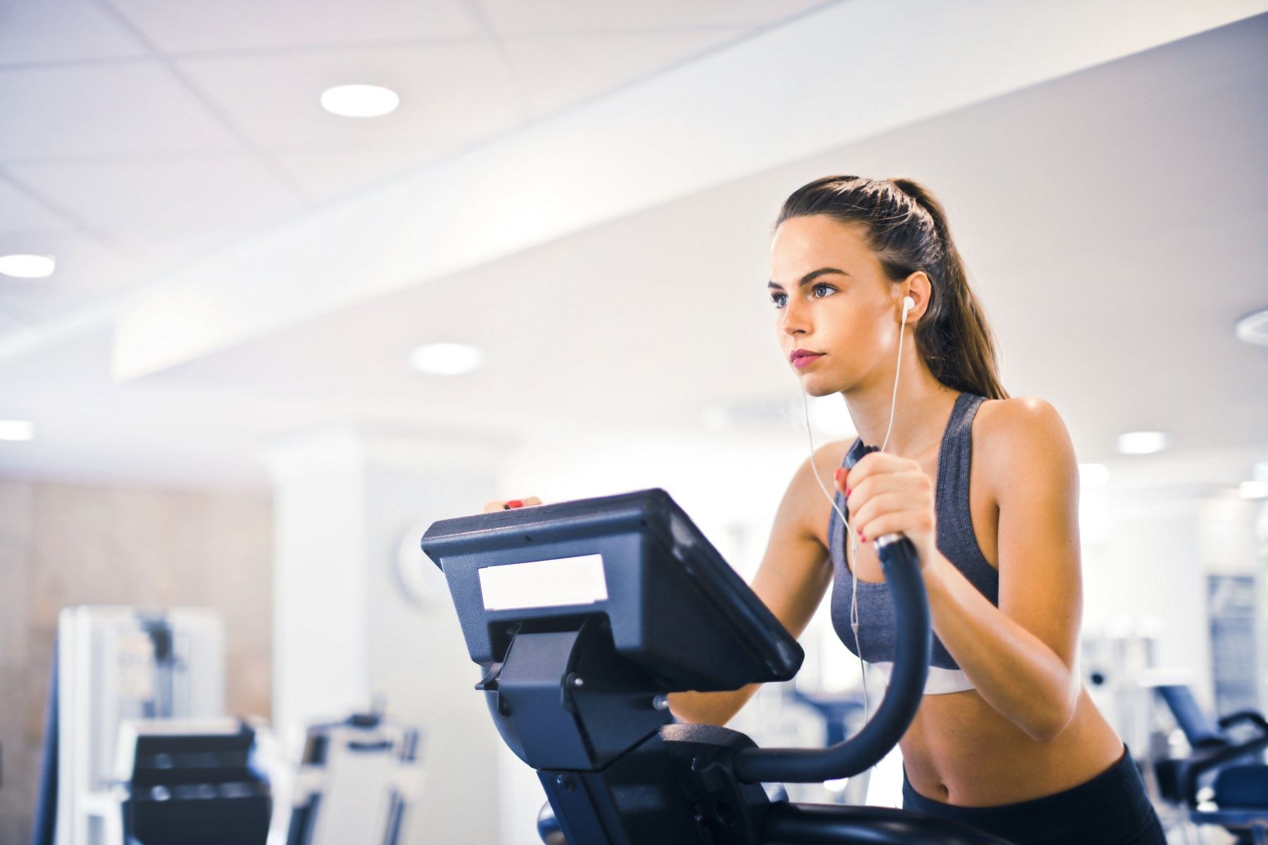A woman exercising on a stationary bicycle